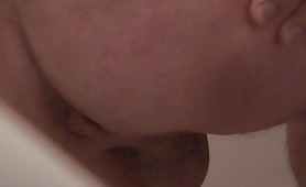 Man shitting a running brown turd on camera