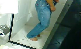 Teen boy shitting diarrhea in shower while pulling down jeans