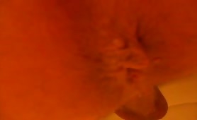 Guy shitting on floor, close up of asshole
