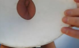 Shitting through a hole