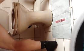 Man shitting on a napkin beside the toilet