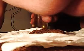 Bald guy eating his fresh turd on bed