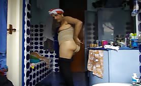 Man in thong shitting in bathroom with towel on head