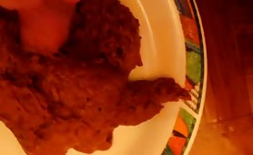Guy shoving his dick into a pile of red shit on a plate