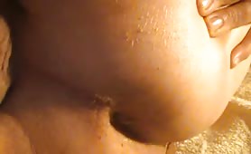 Guy shitting long green turd on bed