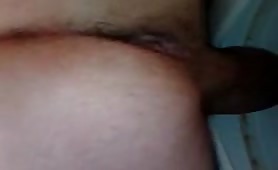 Man shitting in close up on toilet