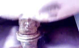 Dildo to the ass in close up