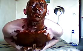 Smearing shit on his entire body