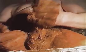Smearing shit on his body