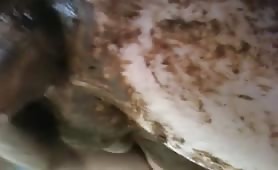 Man smearing shit on his body and hand