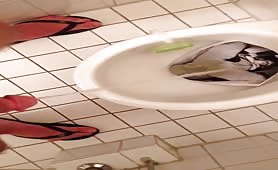 Pissing in an imaginary toilet girl