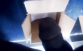 Guy shitting in a cardboard box