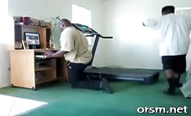Man on knees while another takes a tumble on treadmill
