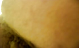 Guy shitting close up, turd sliding out slow