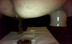 Amateur pooping in the bathroom floor