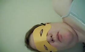 Masked chick eating her own poop