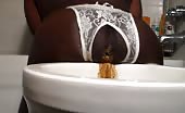 Black girl shitting over toilet
