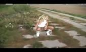 Blonde young babe peeing outdoor