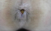 Soft turd shitting out slow on hairy ass