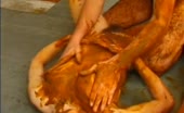 Group smearing shit on each other on tiled floor