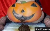 Woman shitting with pumpkin paint on her ass