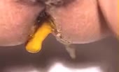 Close up of a horny milf shitting