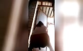 Dark haired babe shitting in the barn