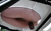 Shaved babe shits on homemade toilet