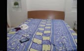 Tattooed babe shitting on bed