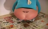 Tattooed milf shits on the carpet