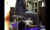 Sexy mistress feeding her female slave from the chair 