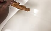Dark booty pooping yellow turd 
