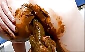 Woman smearing shit on her ass with her hands
