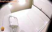 Asian brunette is getting sick in public toilet