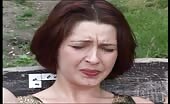 Woman shitting and pissing on park bench