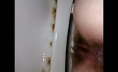 Man shitting on a dirty toilet seat