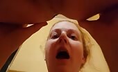 Blonde woman taking shit in her mouth