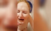 Redhead woman pissing and vomiting in bathtub