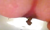 Big brown turd drops from between pink cheeks
