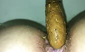 Guy shitting a long brown turd on camera