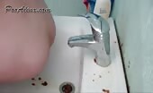 Babe shitting in sink while squatting on stool