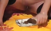 Shirtless person eating crap off a white plate