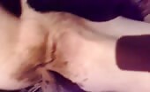 Woman shitting on bed, finger smearing her own crap