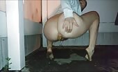 Girl pooping outdoor near the fence barefoot 