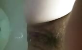 Man pissing into toilet bowl close up