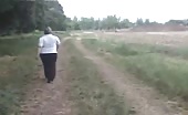 Mature lady take a stroll and decides to poop outside