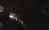 Short haired babe pooping in a garage at night