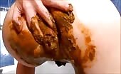 Girl shitting and masturbating with shitty dildo  