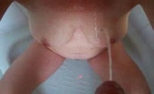 Piss stream hits spread legs with cock in frame