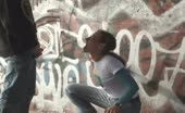 Graffiti wall piss stream between her legs